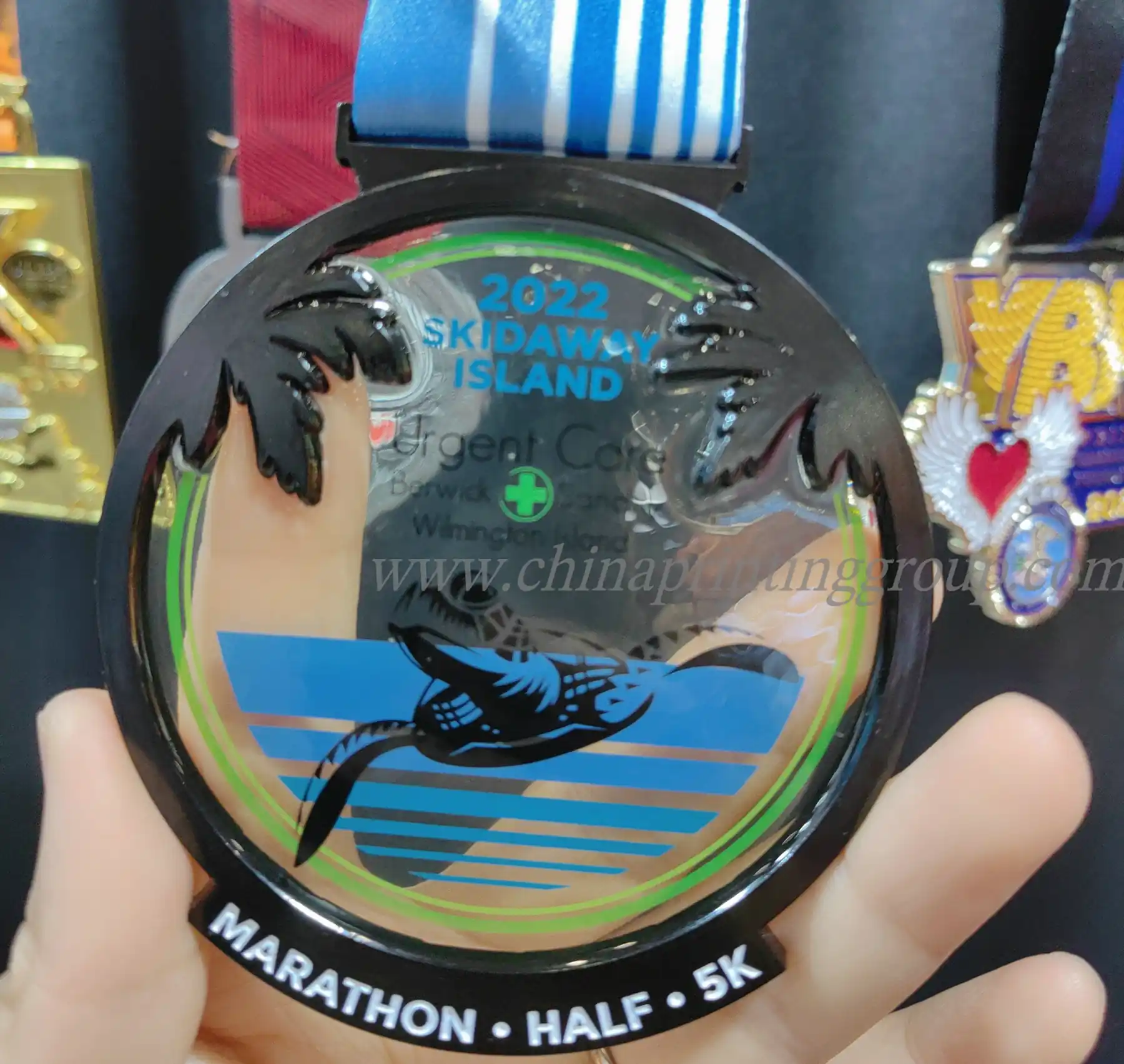 Die cast gold medal showing 3D relief sport design