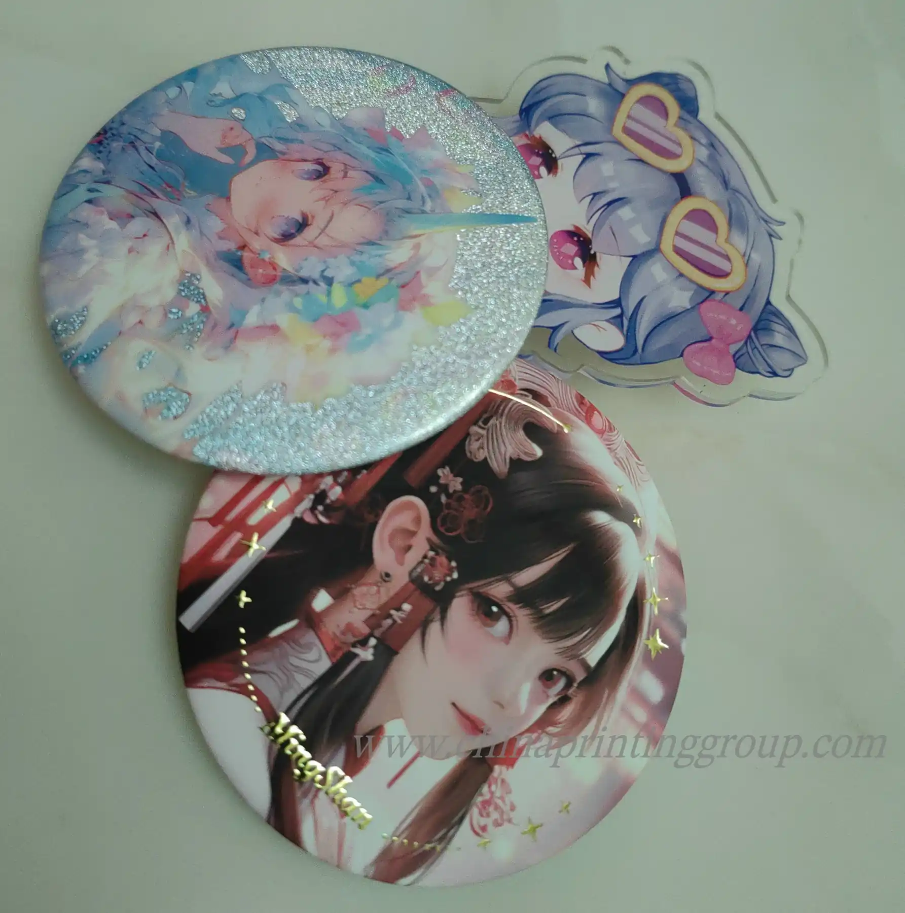 Round tin button badges in several sizes laid out together