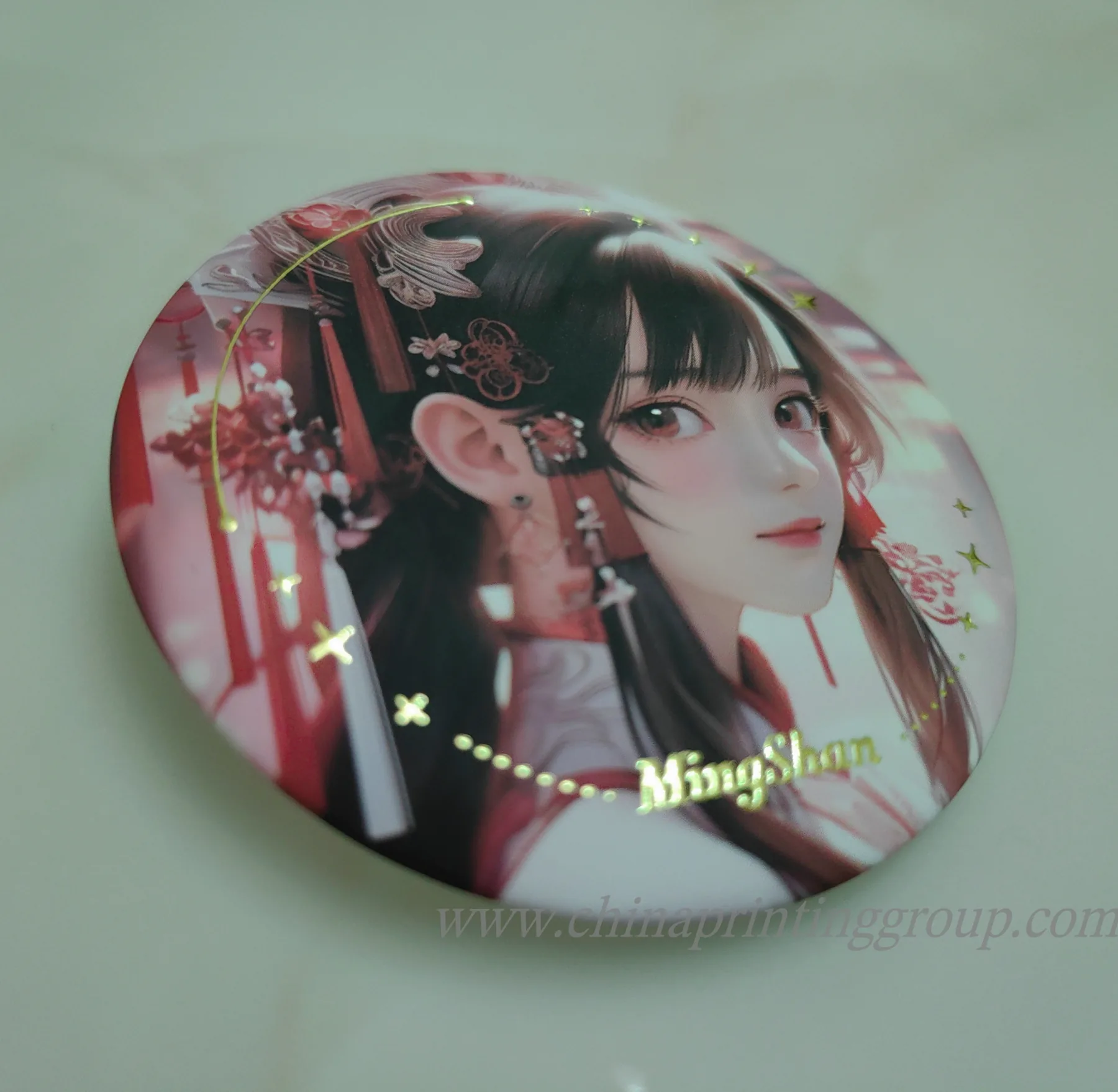 Rear of a metal pin button showing the safety pin fitting