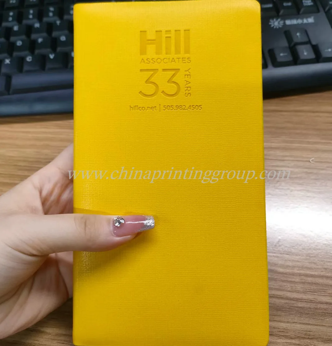 Custom notebook opened to show lined inner pages