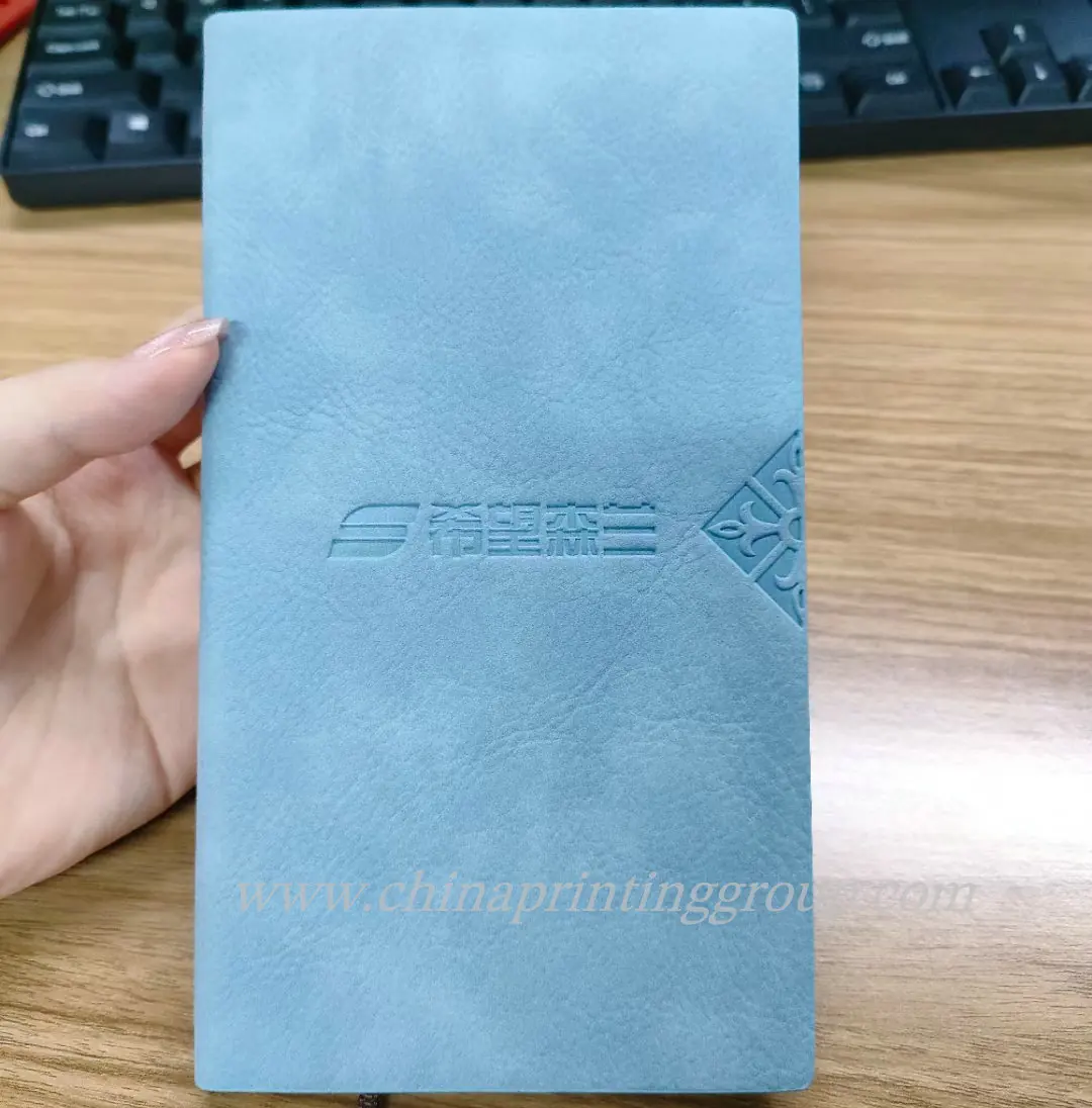 A6 hardcover PU notebook closed with an elastic band
