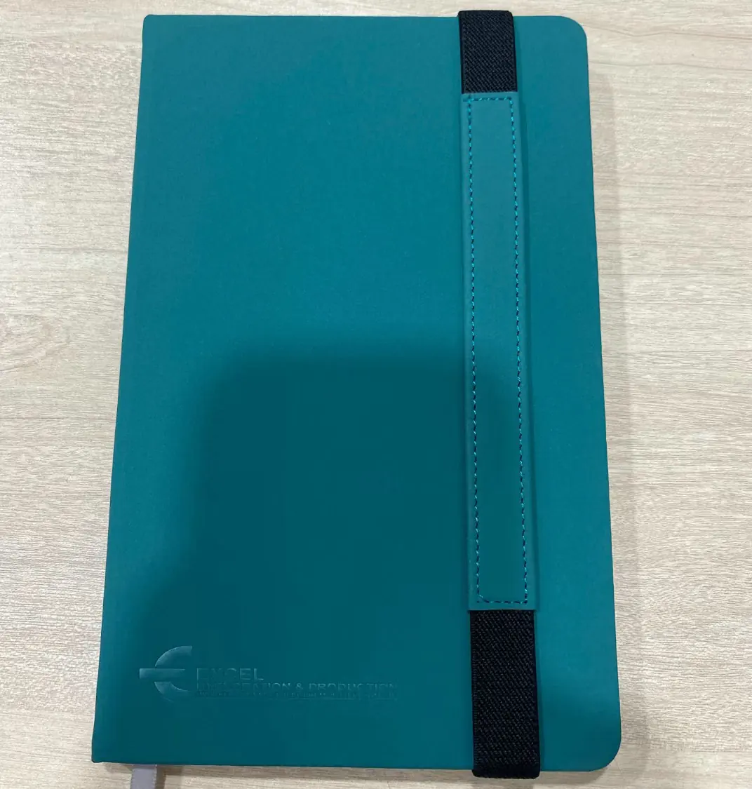 Stack of bulk custom notebooks in different cover colours