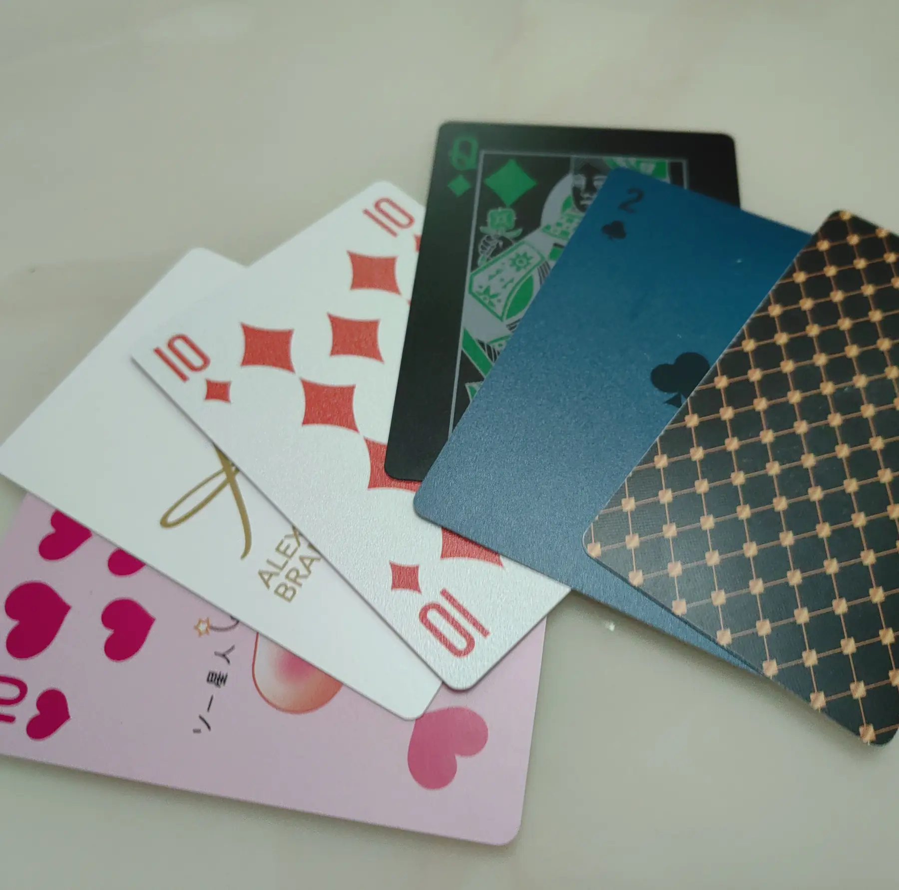 Custom printed poker deck fanned out showing card faces