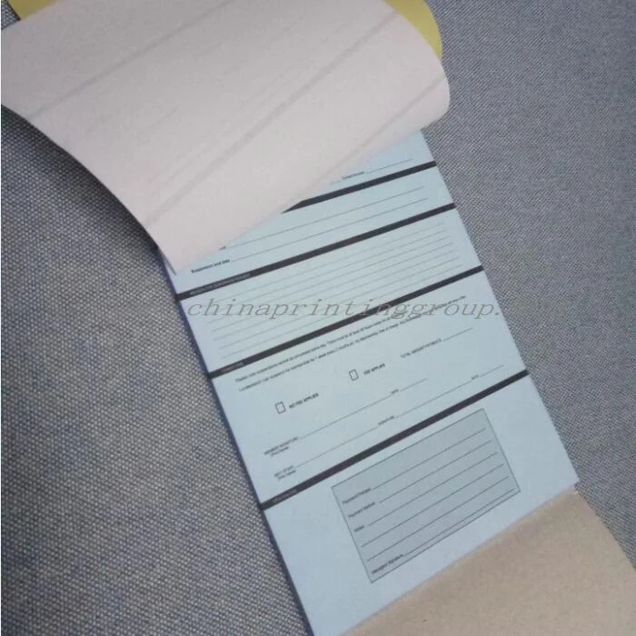 Three part carbonless form set separated to show each ply colour