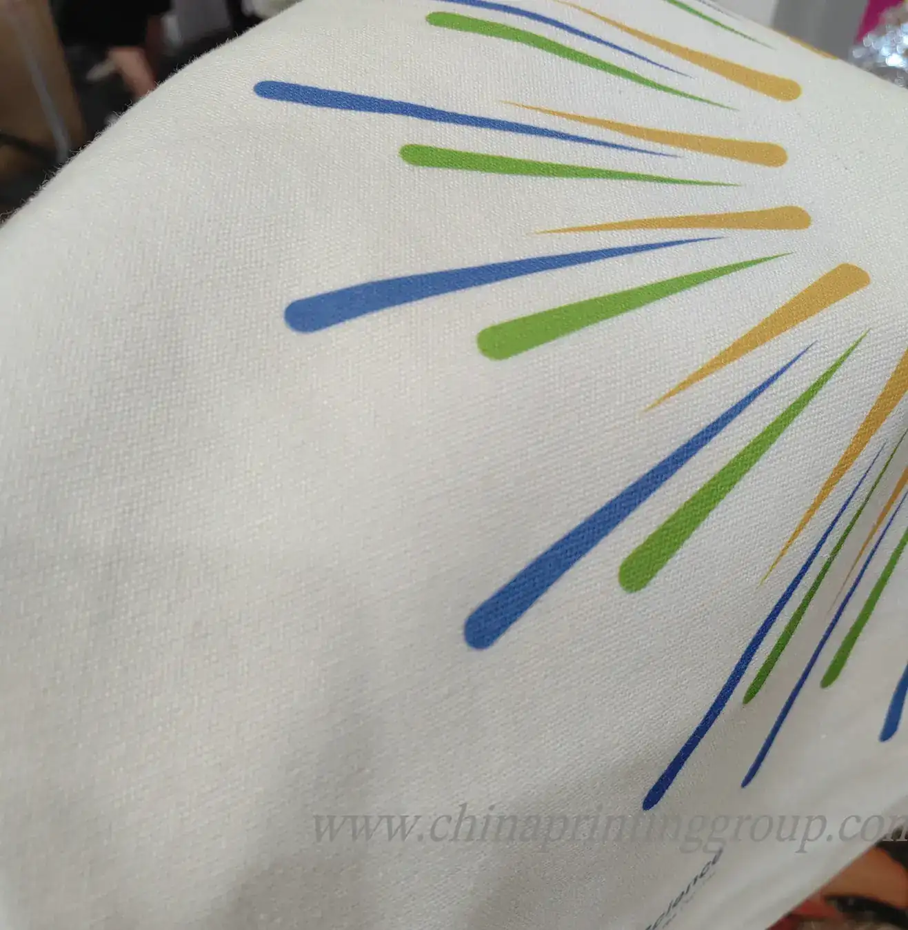 Close view of silk screen printed logo on cotton canvas weave