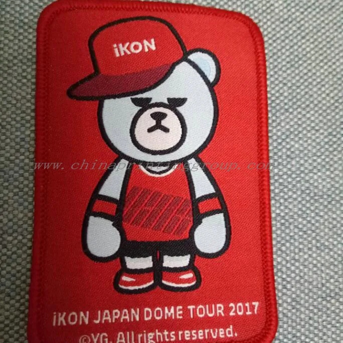 Self-adhesive brand name woven patch for garments