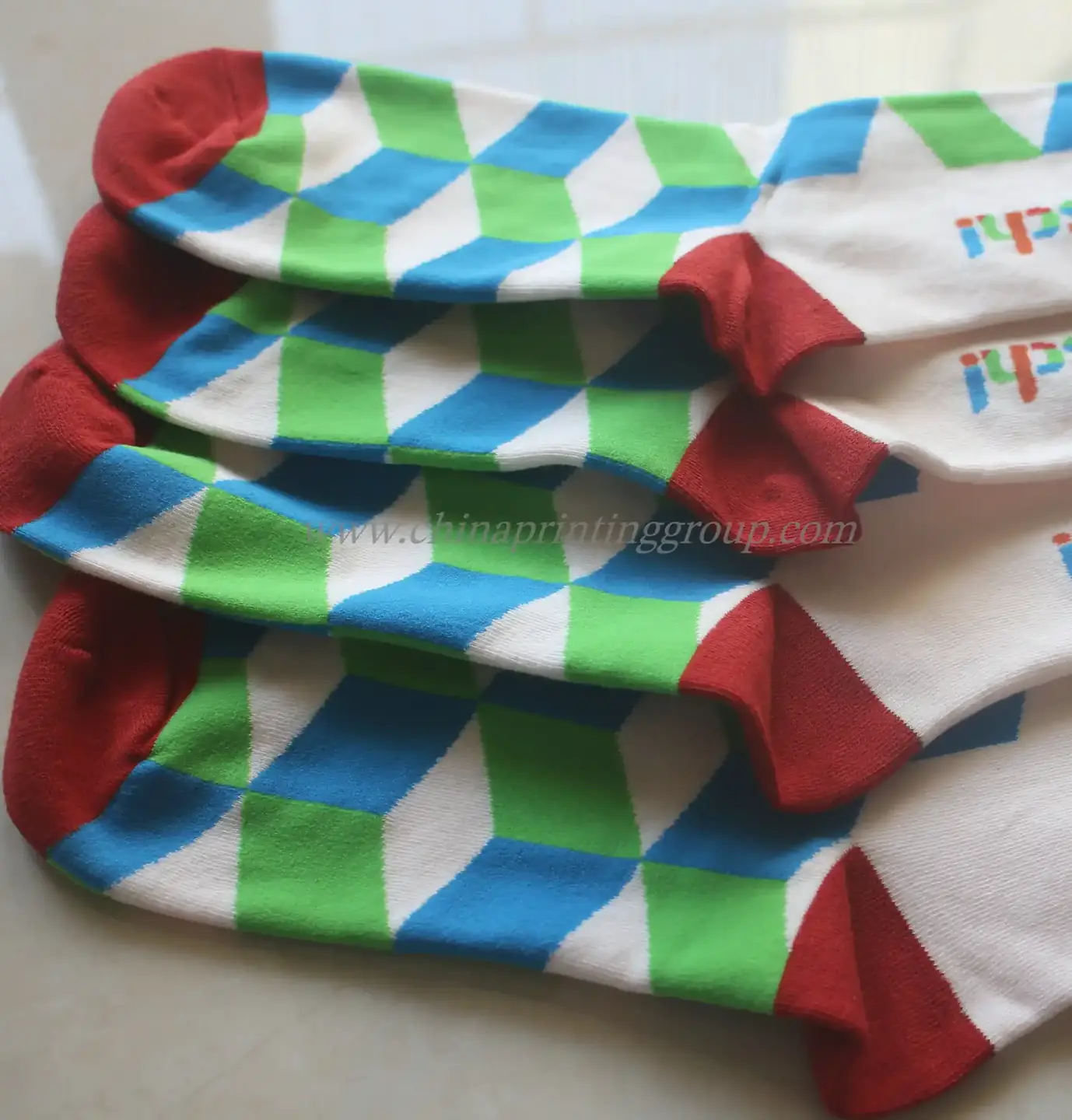 Embroidered logo detail on the ankle of a custom sock