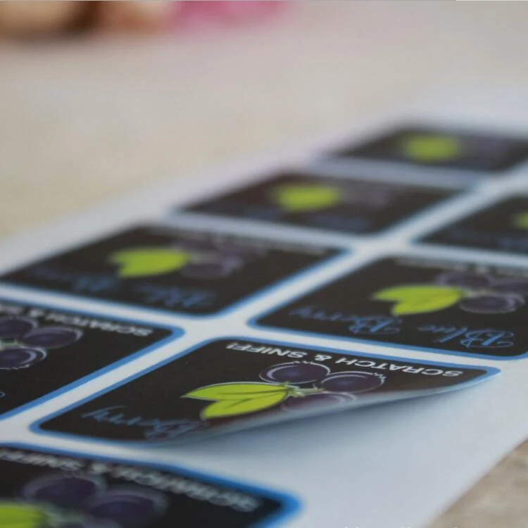 Die cut scratch and sniff stickers on backing paper