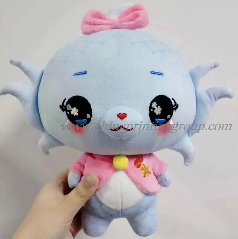 Soft plush doll showing stitched face detail and short plush fabric