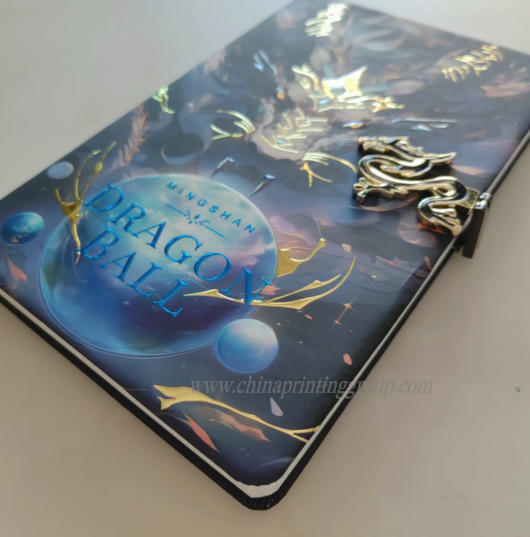 Custom shape metal tag attached to a PU leather notebook cover