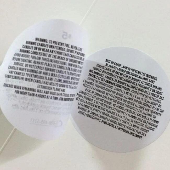 Double sided sticker applied to a shop window showing both printed faces