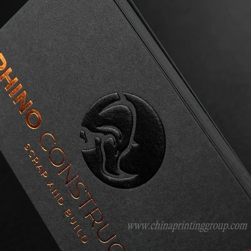 Thick embossed business cards stacked to show paper edge
