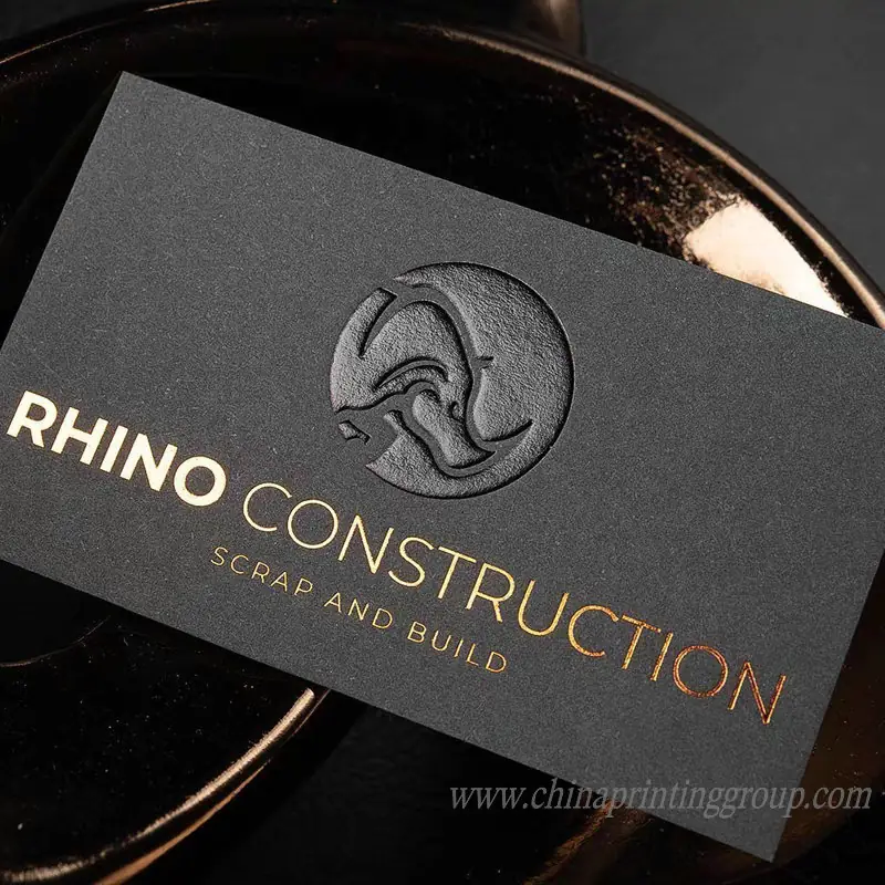 Business card with gold foil stamping and embossed text
