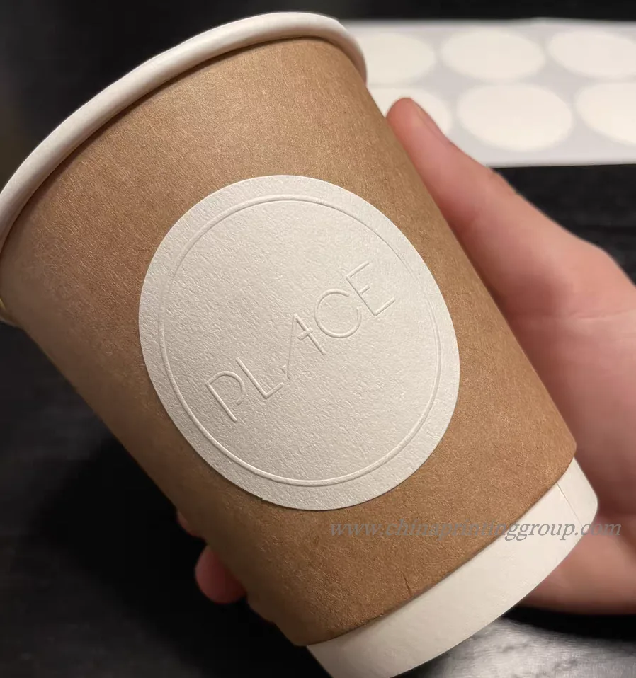Close view of raised embossed logo texture on a paper seal