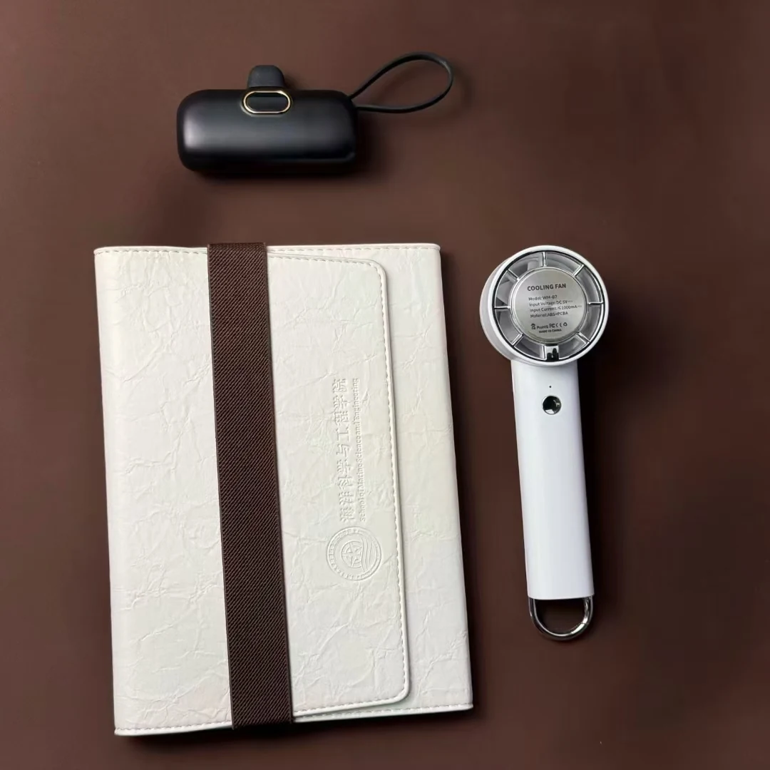 Inexpensive business gift set laid out with mug and towel