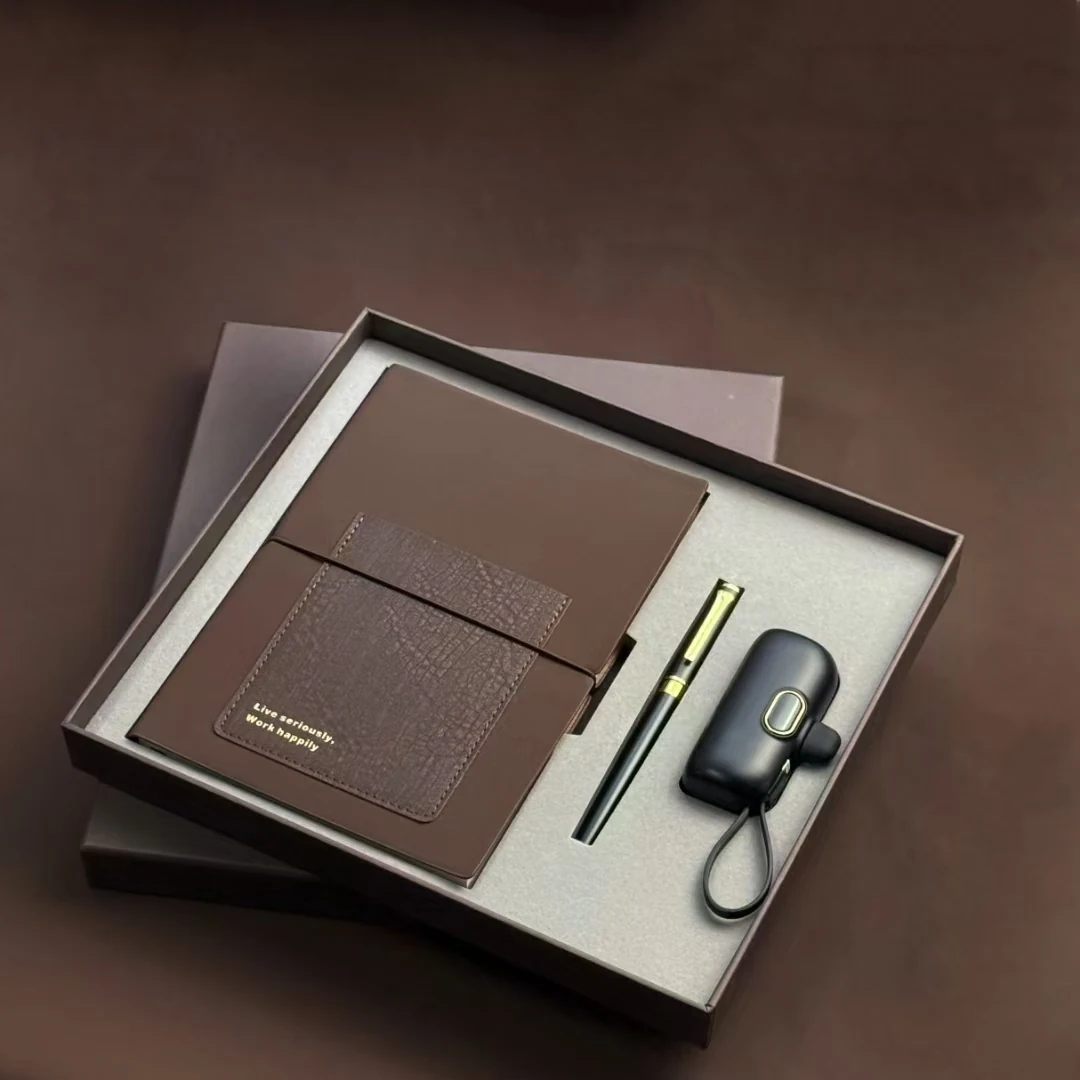 Branded vacuum flask and accessories arranged as a corporate giveaway