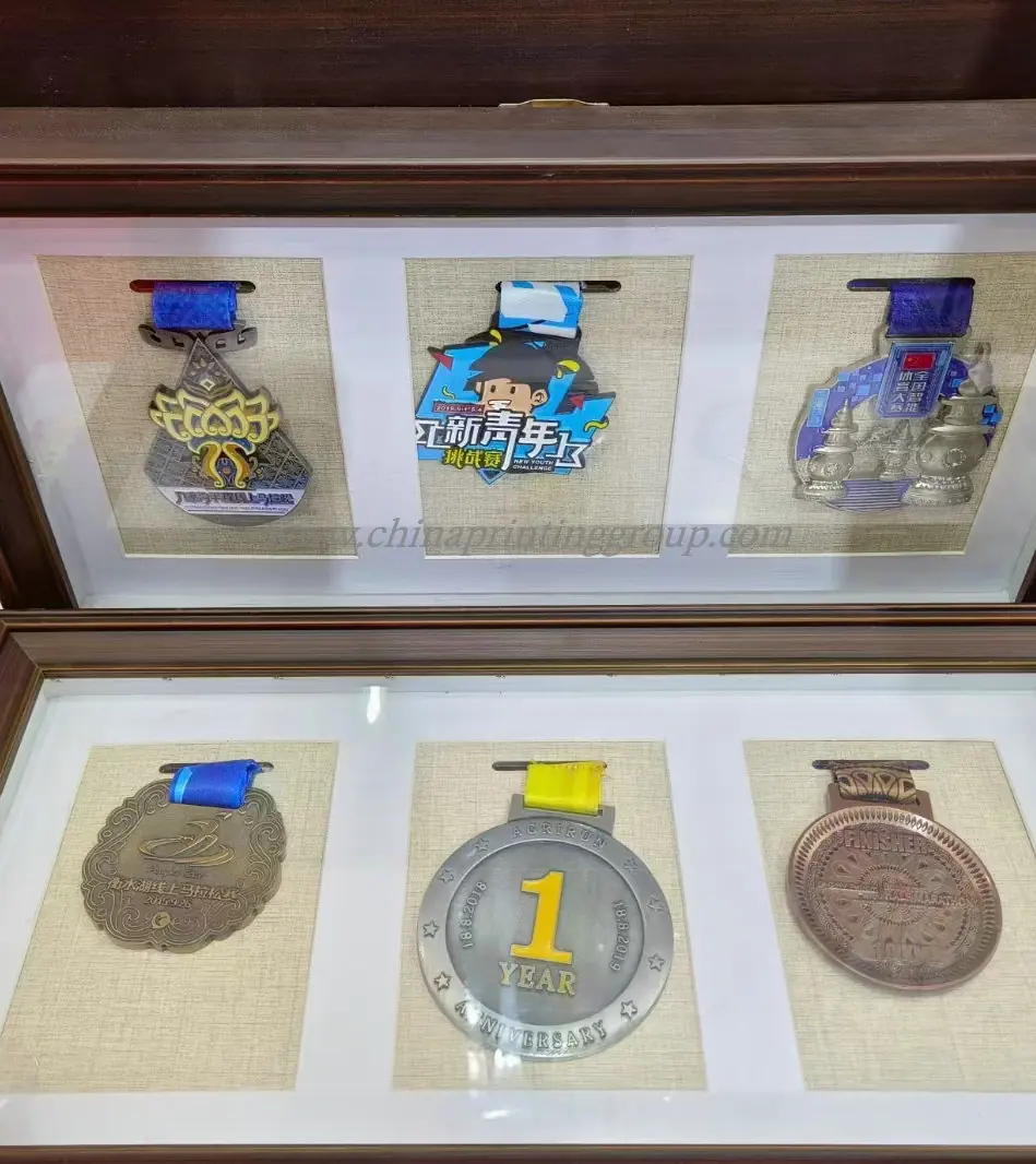 Self adhesive metal logo plates arranged for inspection