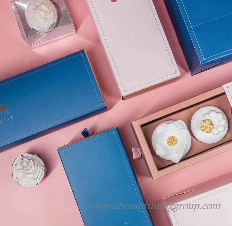 Cardboard drawer gift box with ribbon pull and foil stamped logo
