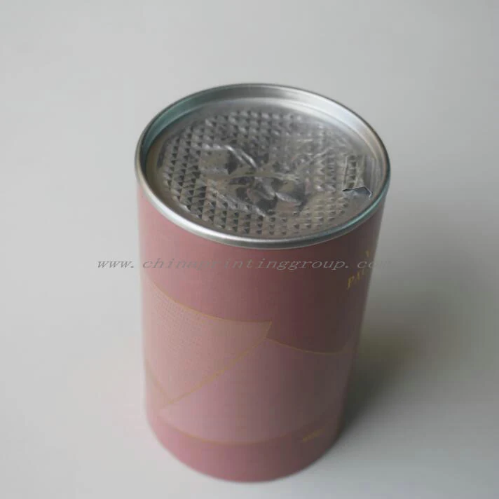 Close view of aluminium slip lid seated on a paper tube container rim