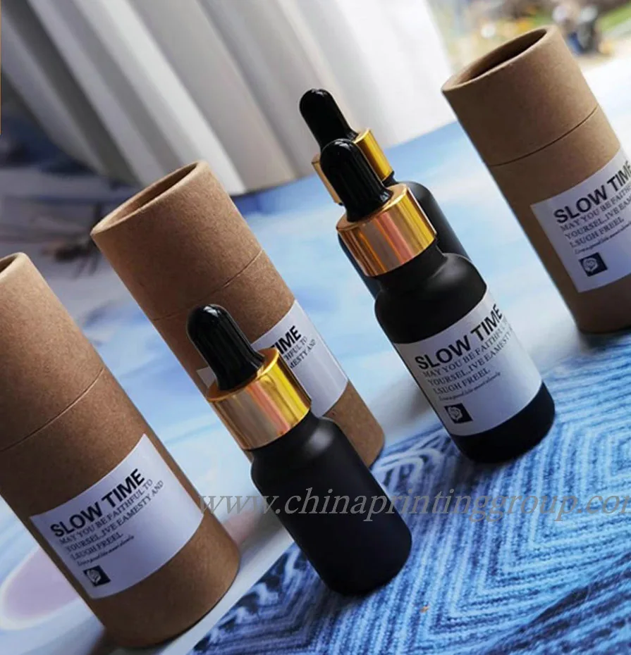 Paper tube packaging with essential oil bottle placed beside it