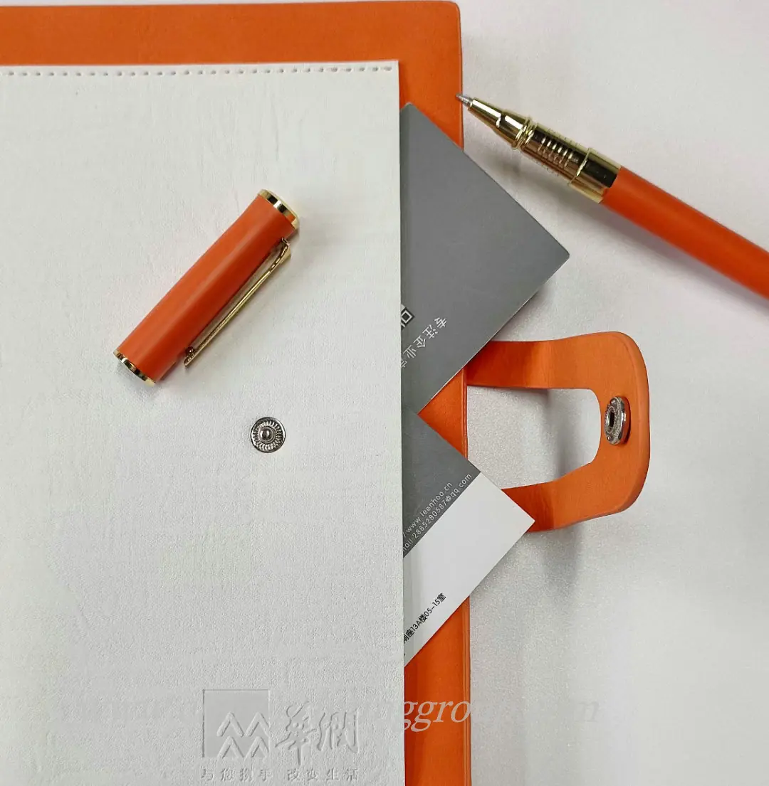 Metal gift pen shown beside its presentation case