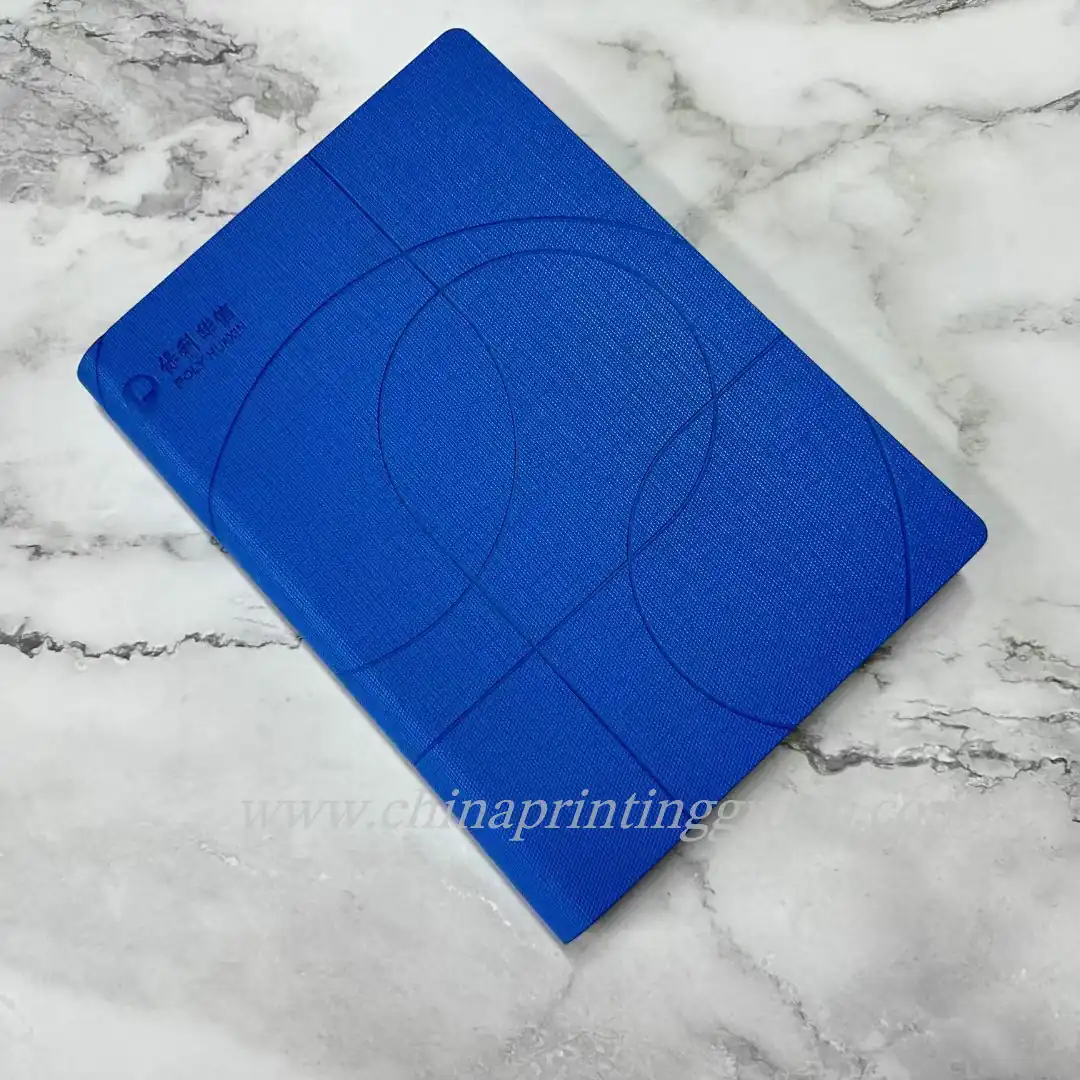 Hardcover notebook with gold foil logo on the cover