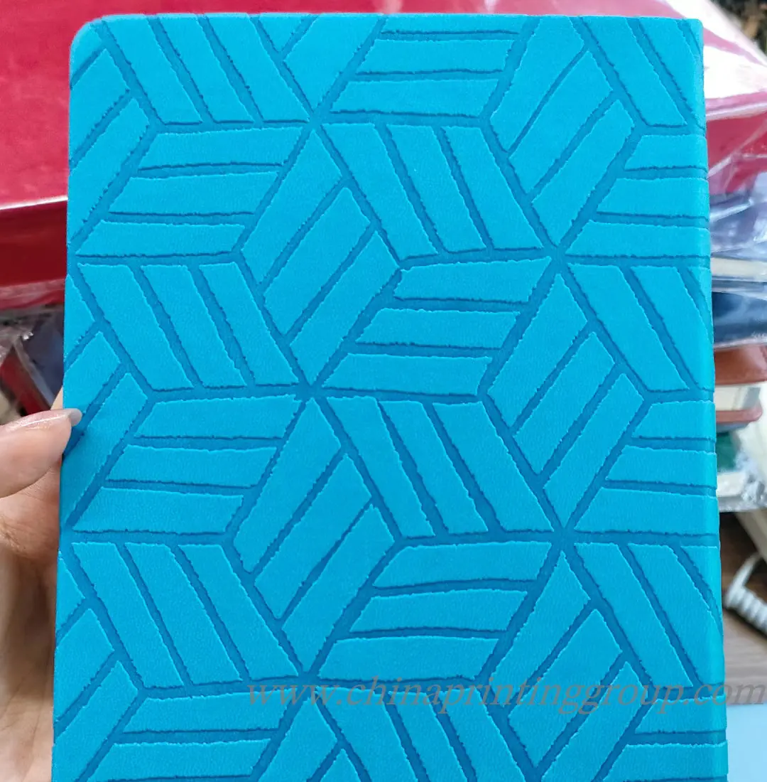 Fabric cover notebook with embroidered company logo
