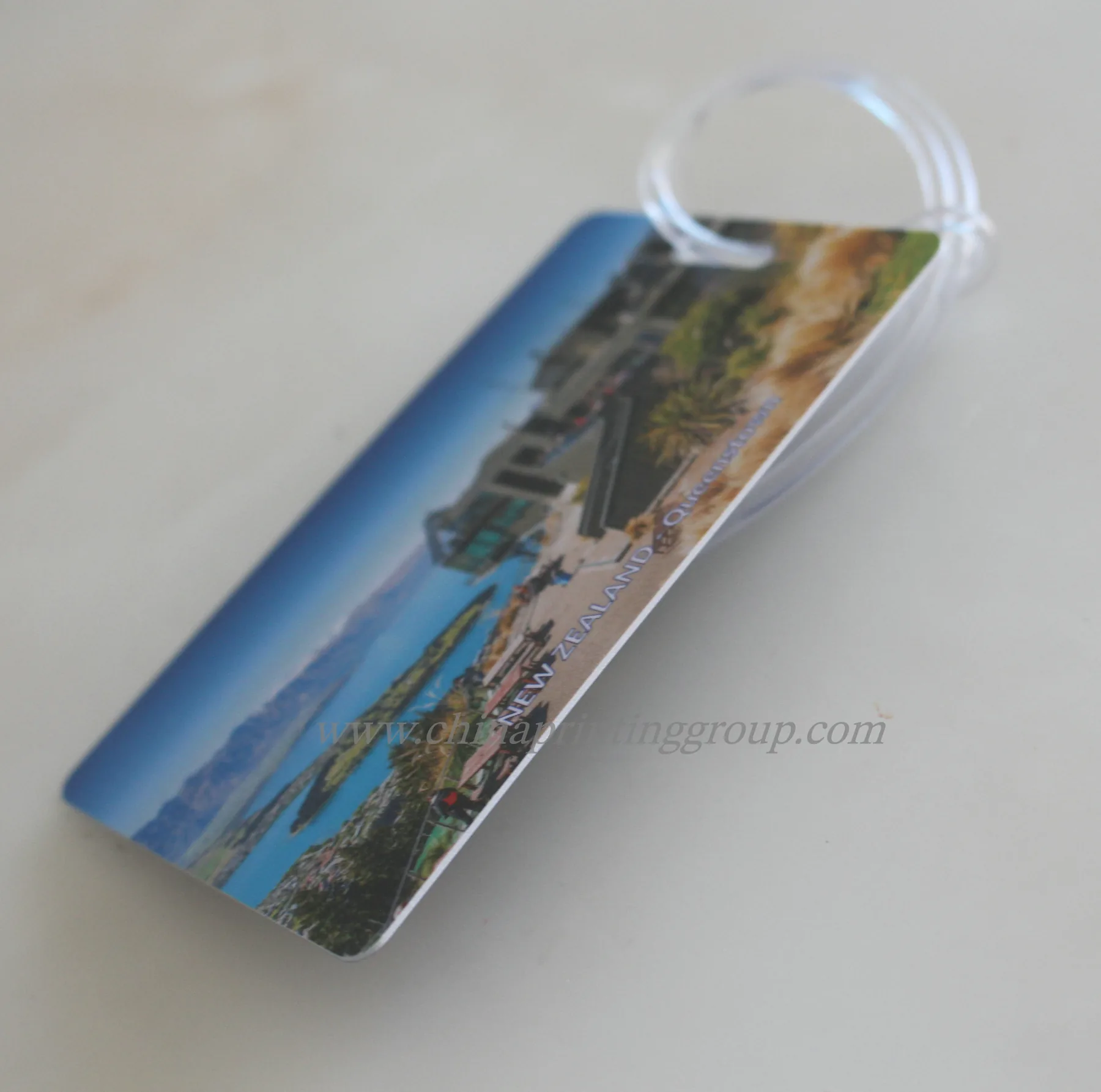 Rubber luggage tag showing embossed lettering with colour fill