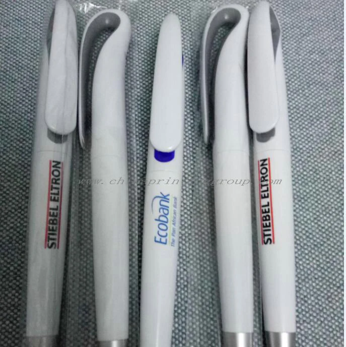 Plastic pen with rubberised grip and contrasting plunger