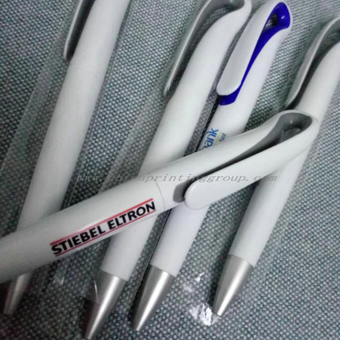 Plastic ballpoint pen shown with the clip and click button