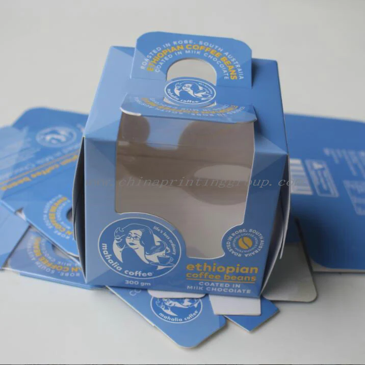 Square printed boxes with windows displayed on a shelf