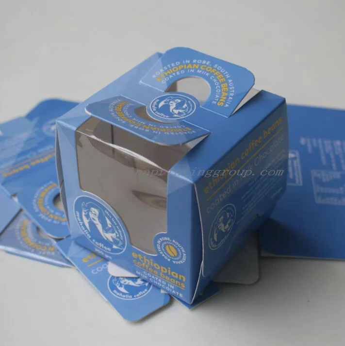 Coffee box shown open with beans visible through the window