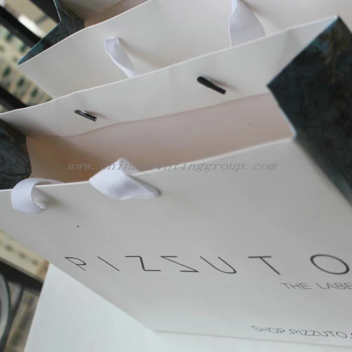 Retail gift bag held open to show the interior and base