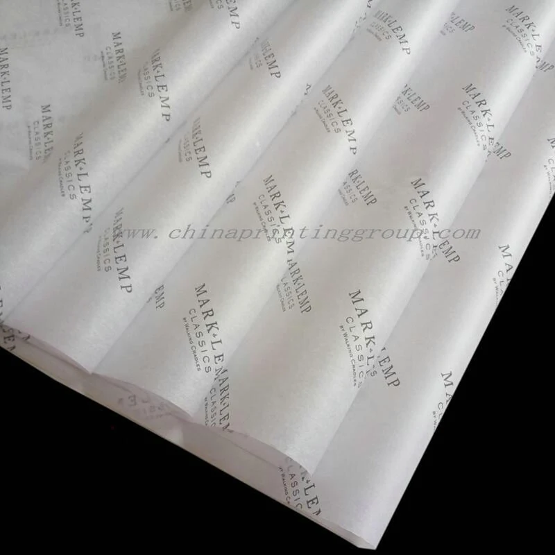 Stack of printed wrapping tissue sheets before packing