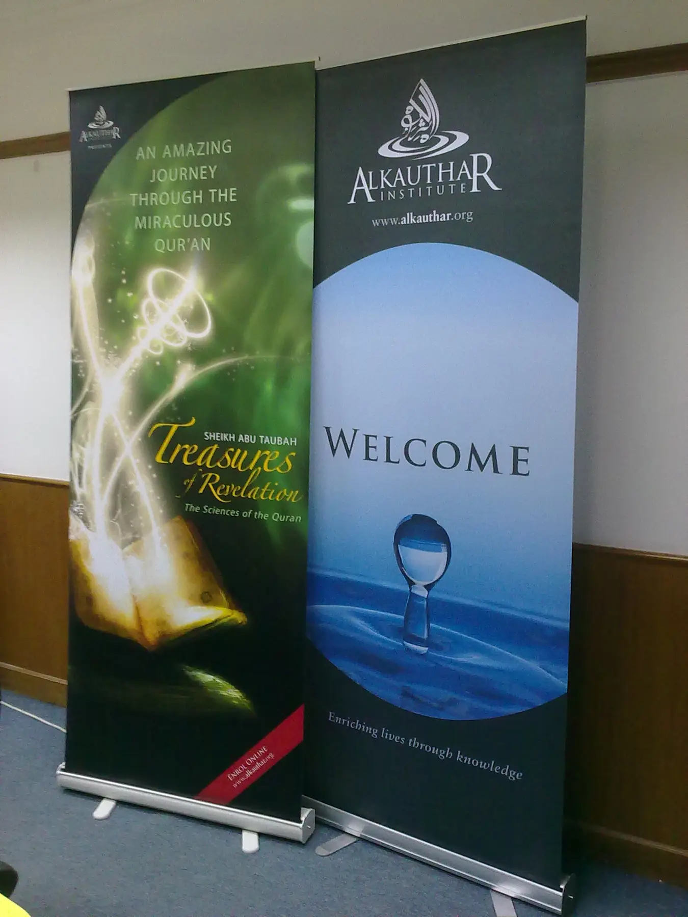 Roll up banner graphic being extended from its aluminium base