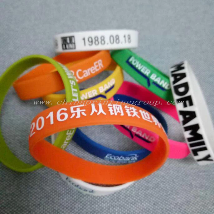 Multi colour custom silicone bracelets laid out flat