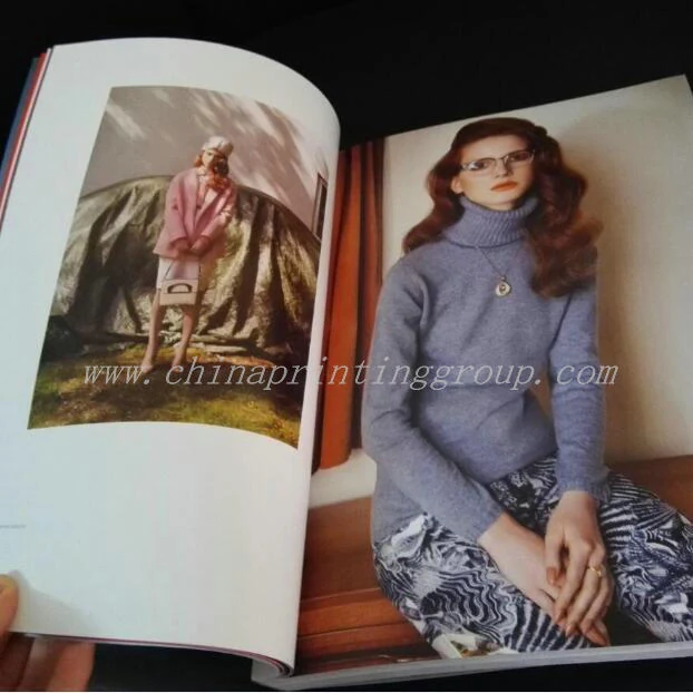Softcover book opened showing CMYK printed inner pages