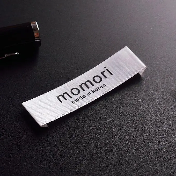 Fabric garment labels in assorted sizes and colours
