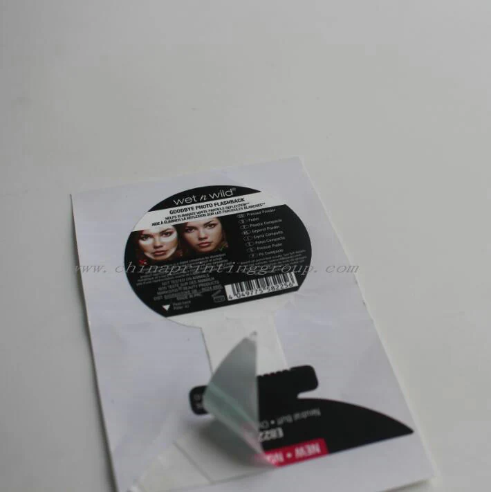 Stack of printed label sheets before packing
