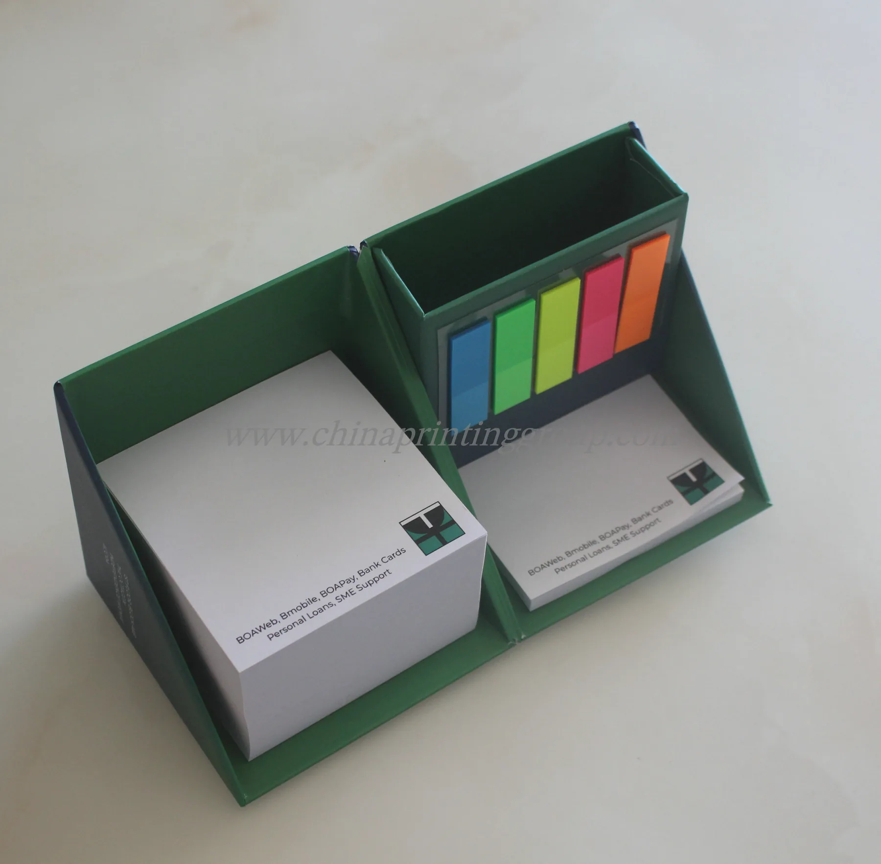 Sticky notes set open to show pad, index tabs and pen holder