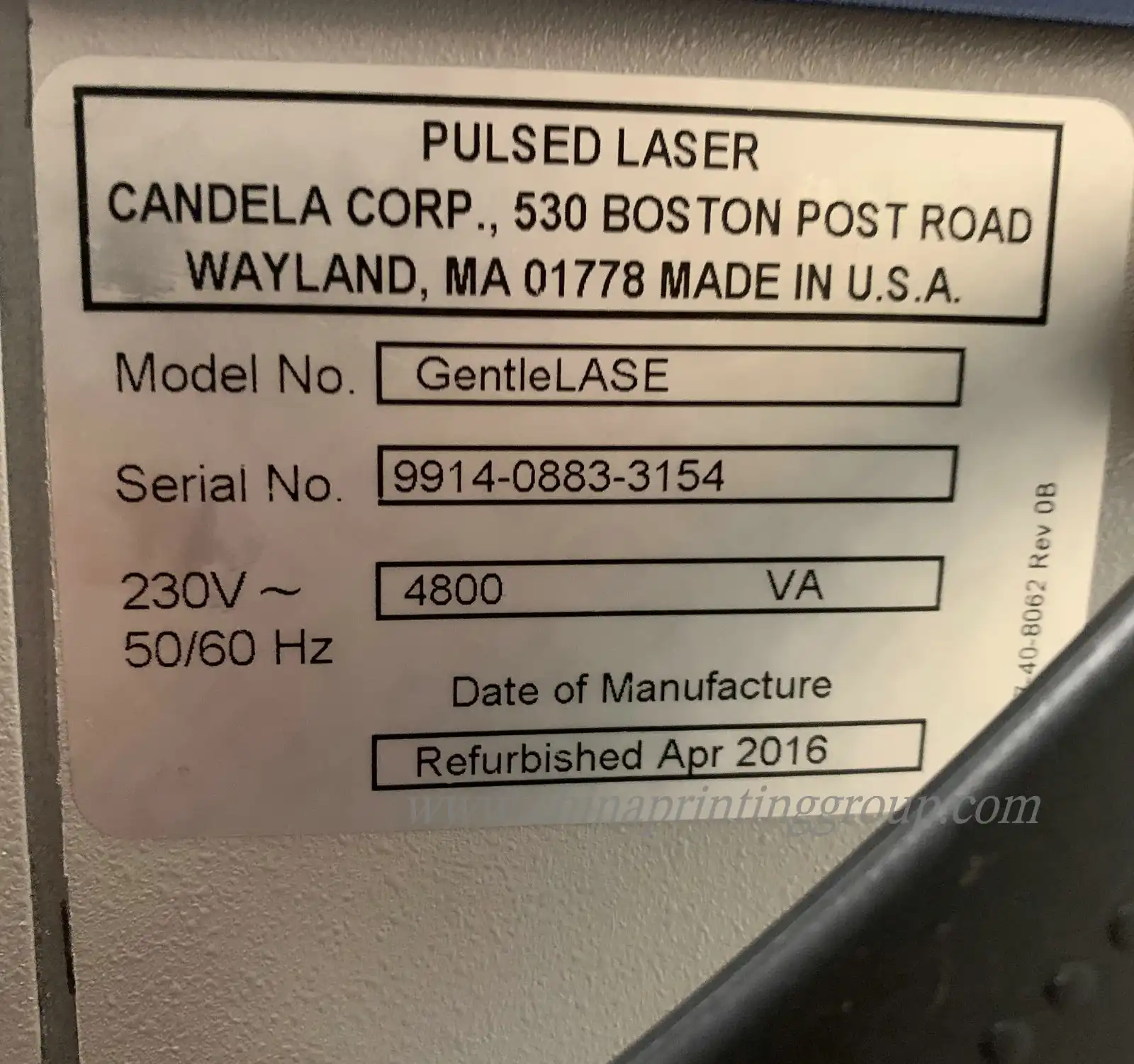 Close view of matte silver vinyl label surface and printed code