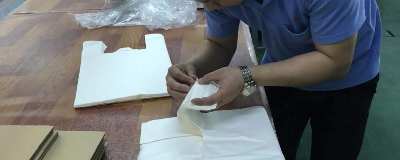 Printed bags being checked and packed at the Haolu Trading operation in Guangzhou