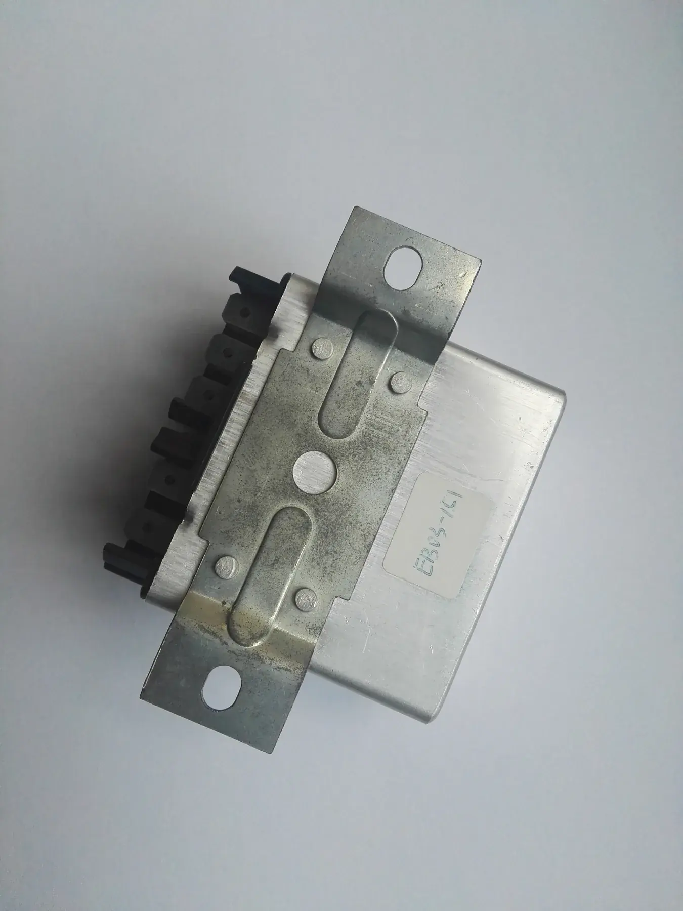 Truck electronic control unit with its mounting bracket and multi pin connector
