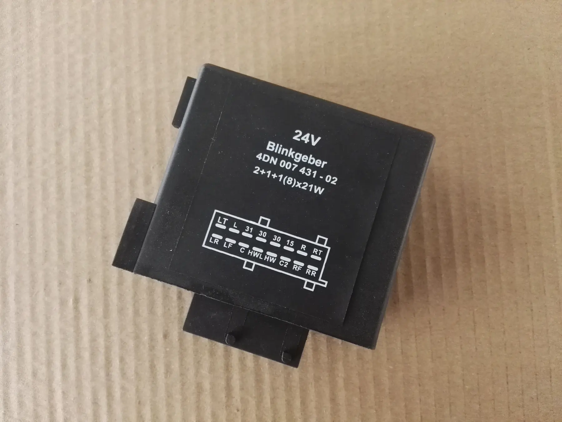 Flasher unit with the pin layout printed on the case so the fitter can check the connector