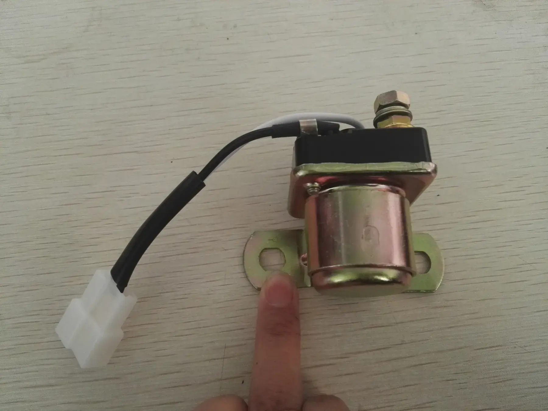 Solenoid valve assembly with the loom connector attached ready for testing