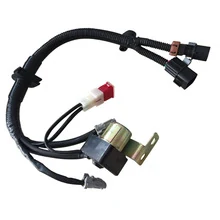 Automotive wire harness assembly with black hoses, electrical connectors and metal mounting bracket on white background