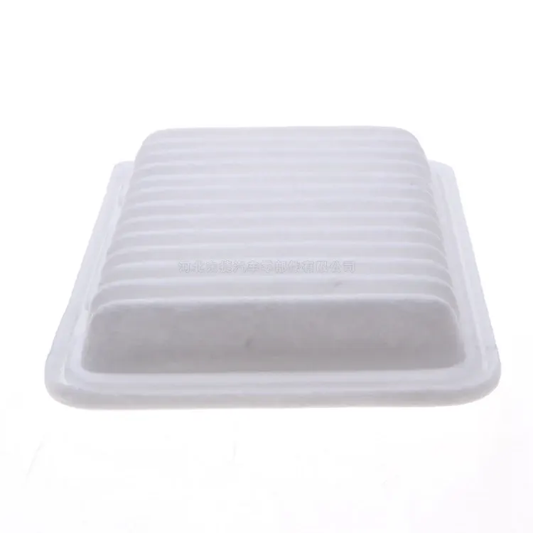 17801-0T020 engine air filter in a white plastic bag, showing the filter body and paper media