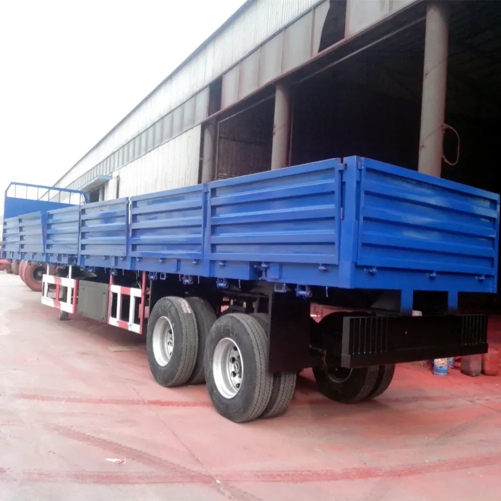 Side wall semi trailer with 12 twist locks, parked on a yard, front three-quarter view