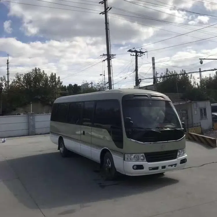 Used Toyota Coaster luxury bus in original Japanese colour, front three-quarter view