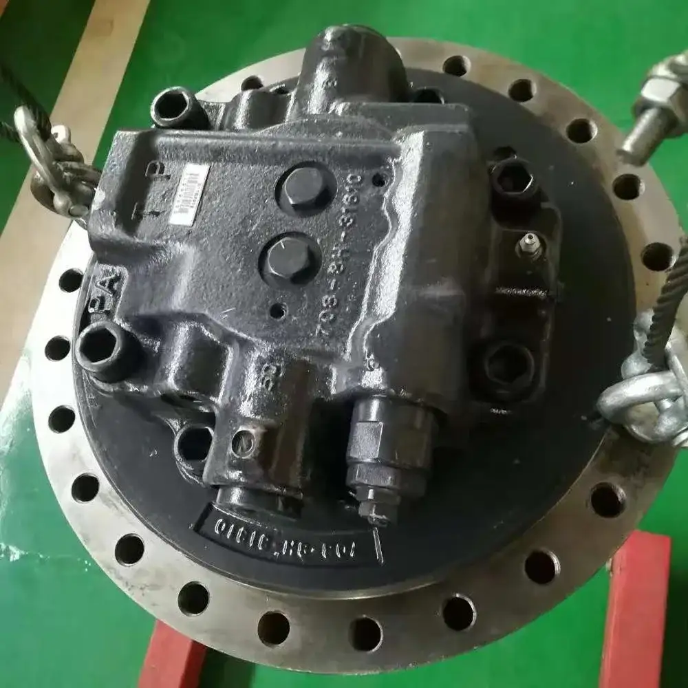 Final drive assembly with travel motor 207-27-00372 and 207-27-00371 mounted on a steel stand, front view showing gear housing and mounting flanges